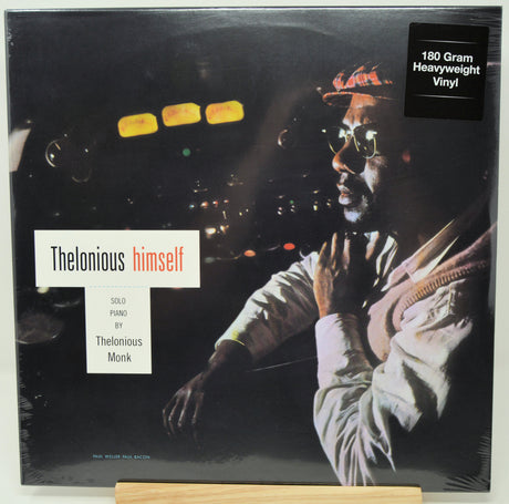 Thelonious Monk 'himself' 180g heavyweight vinyl LP album cover, showing a black-and-white portrait of the musician with a red hat and sunglasses, plus a black '180 Gram Heavyweight Vinyl' sticker in the top right.