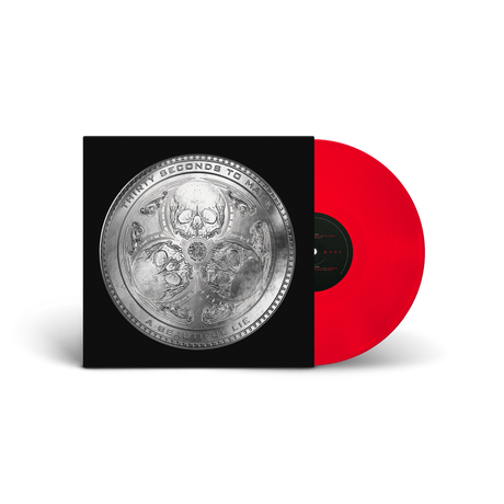 Vinyl record with a red disc and black cover featuring intricate designs.