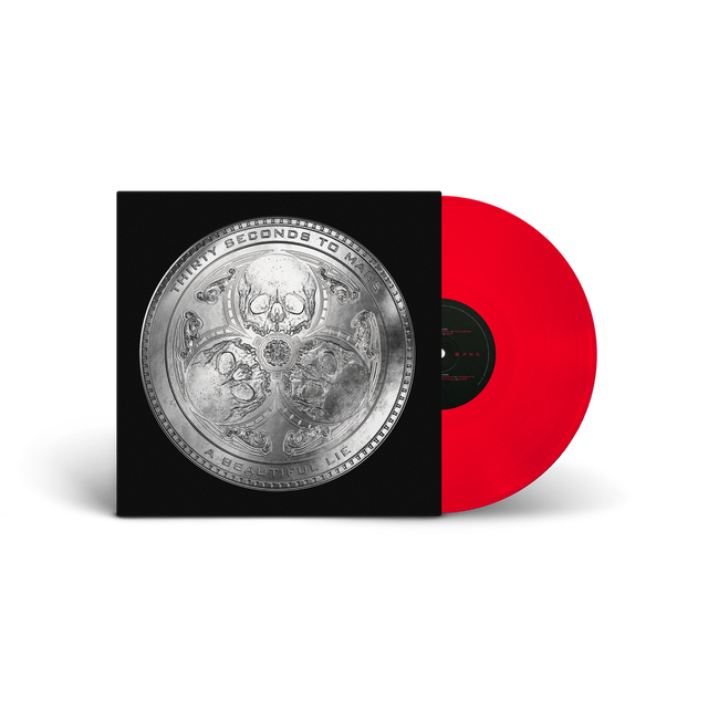 Vinyl record with a red disc and black cover featuring intricate designs.