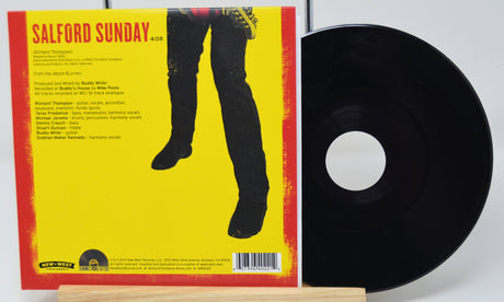 Vinyl record with yellow cover featuring a silhouette and text
