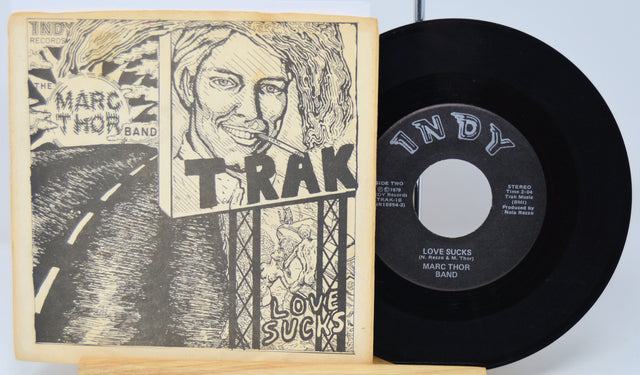 Vinyl record with cover featuring a stylized illustration of a person and text.