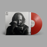 Black and white album cover with a phote of Thundercat wearing a leather jacket and holding a phone to their ear, featuring Brainfeeder Music Records logo.