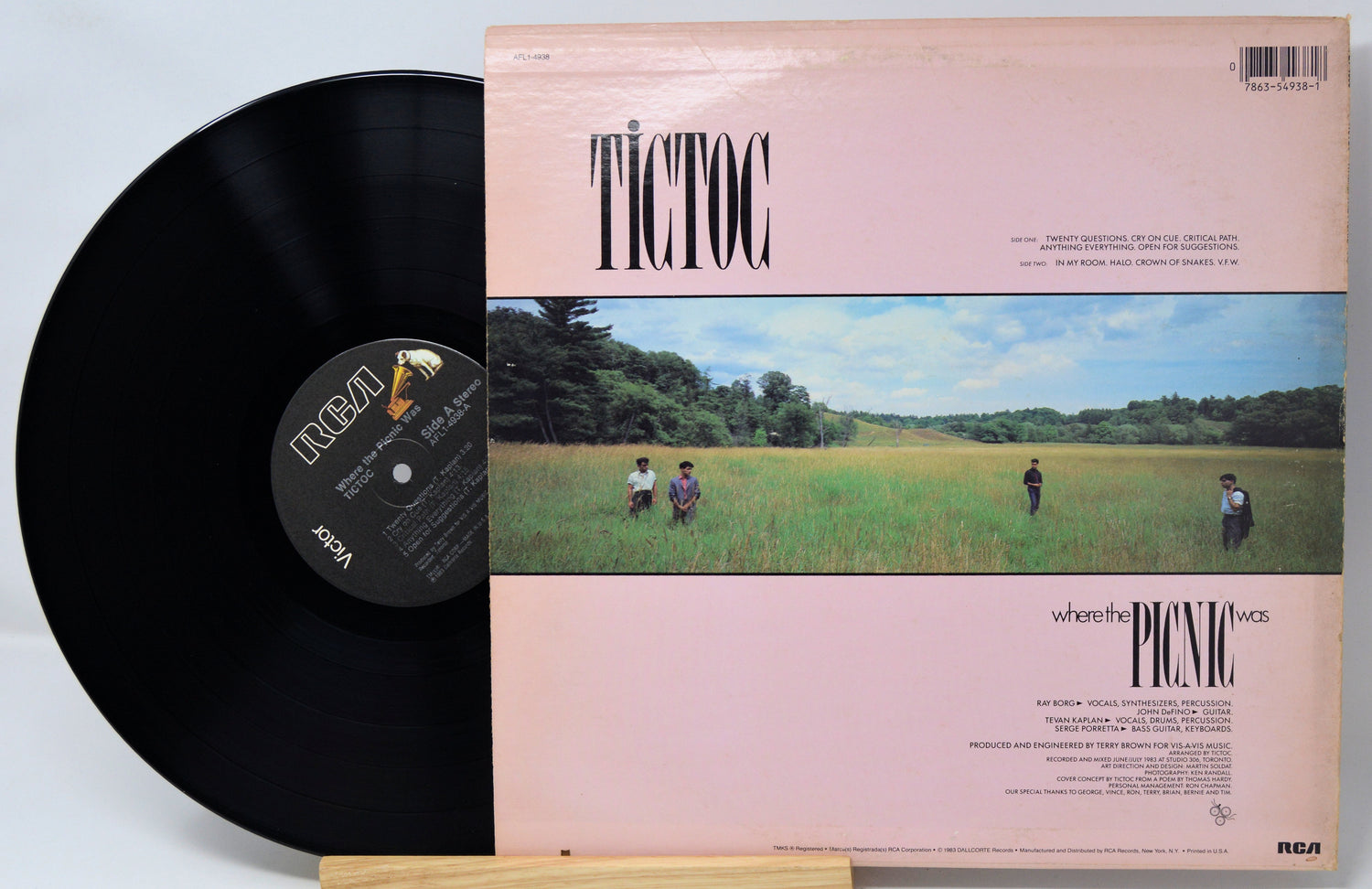 Vinyl record with 'Tictoc' album cover showing people in a field