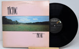 Vinyl record and cover with 'Tictoc' and 'Picnic' text on a light gray background
