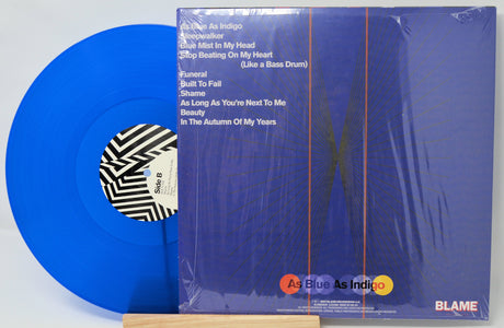 Back cover and blue vinyl of Tigercub's As Blue As Indigo LP with tracklist