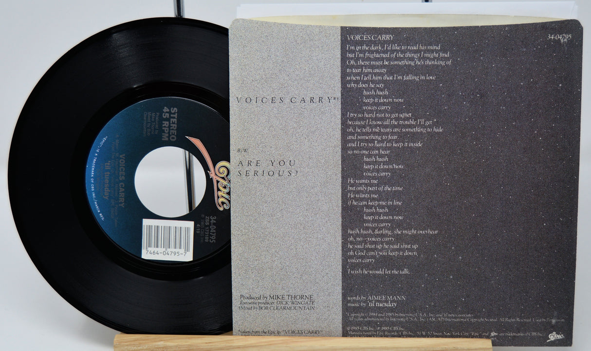Vinyl record with label and text on a white background