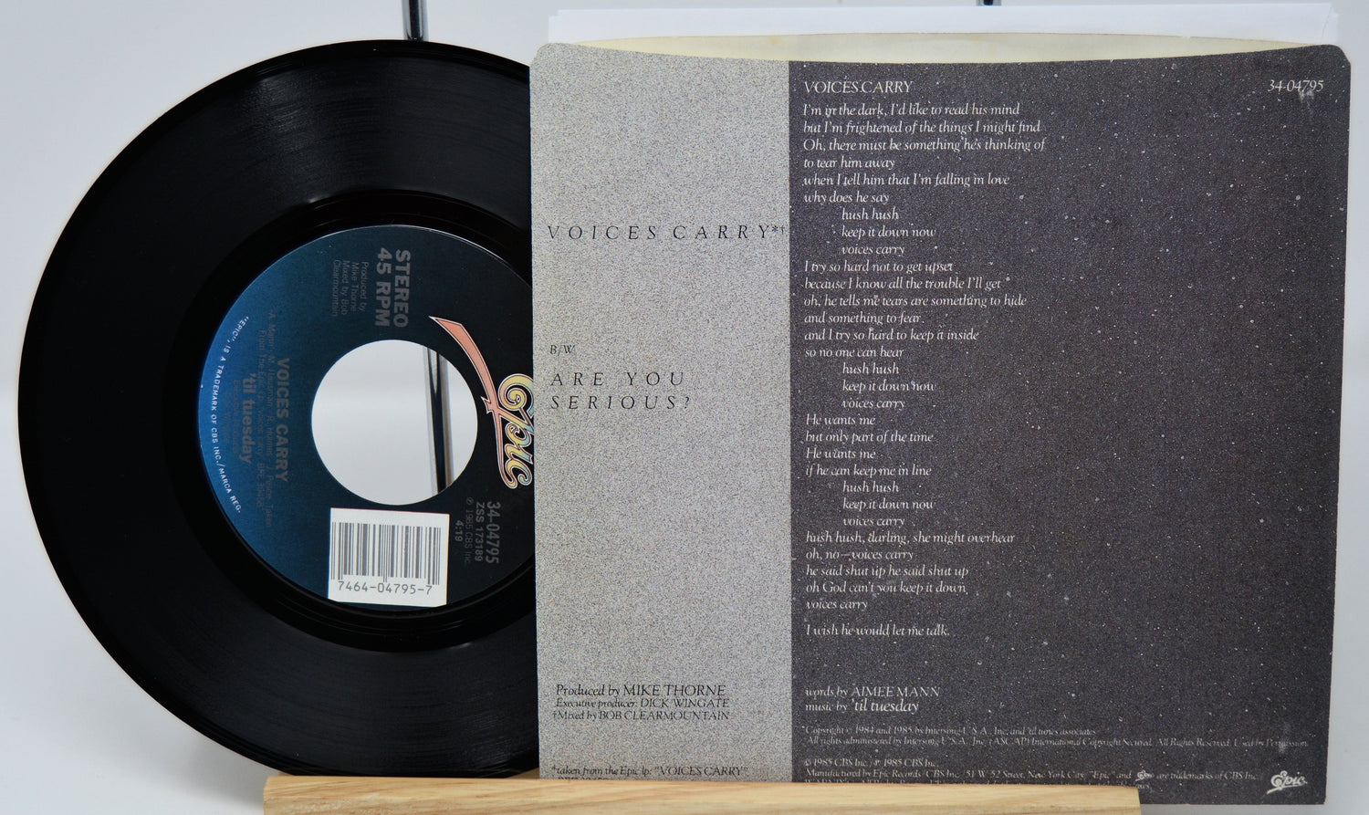 Vinyl record with label and text on a white background