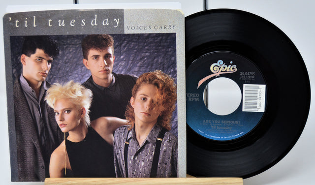 Vinyl record and cover with 'Epic' label on a white background