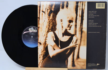Vinyl record with cover featuring a black and white image of a child against a textured background.