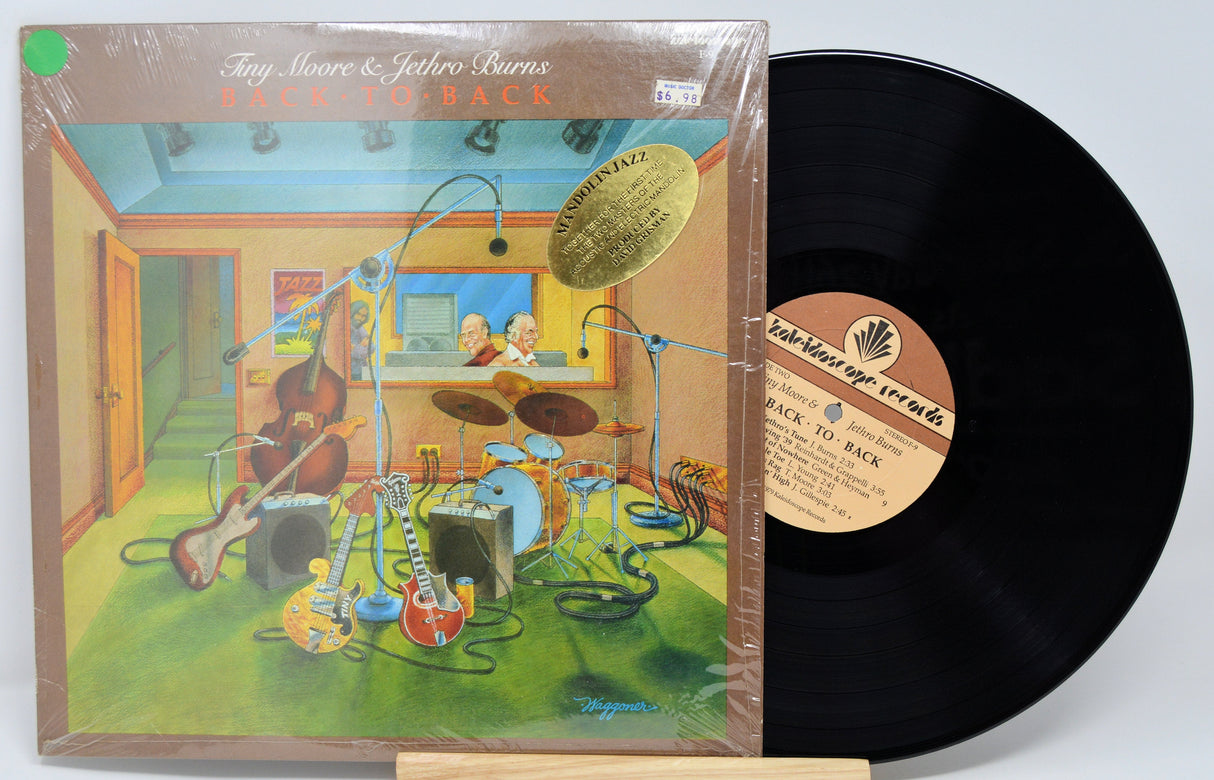 Front cover illustration of Tiny Moore & Jethro Burns' Back to Back vinyl LP with jazz instruments in a studio