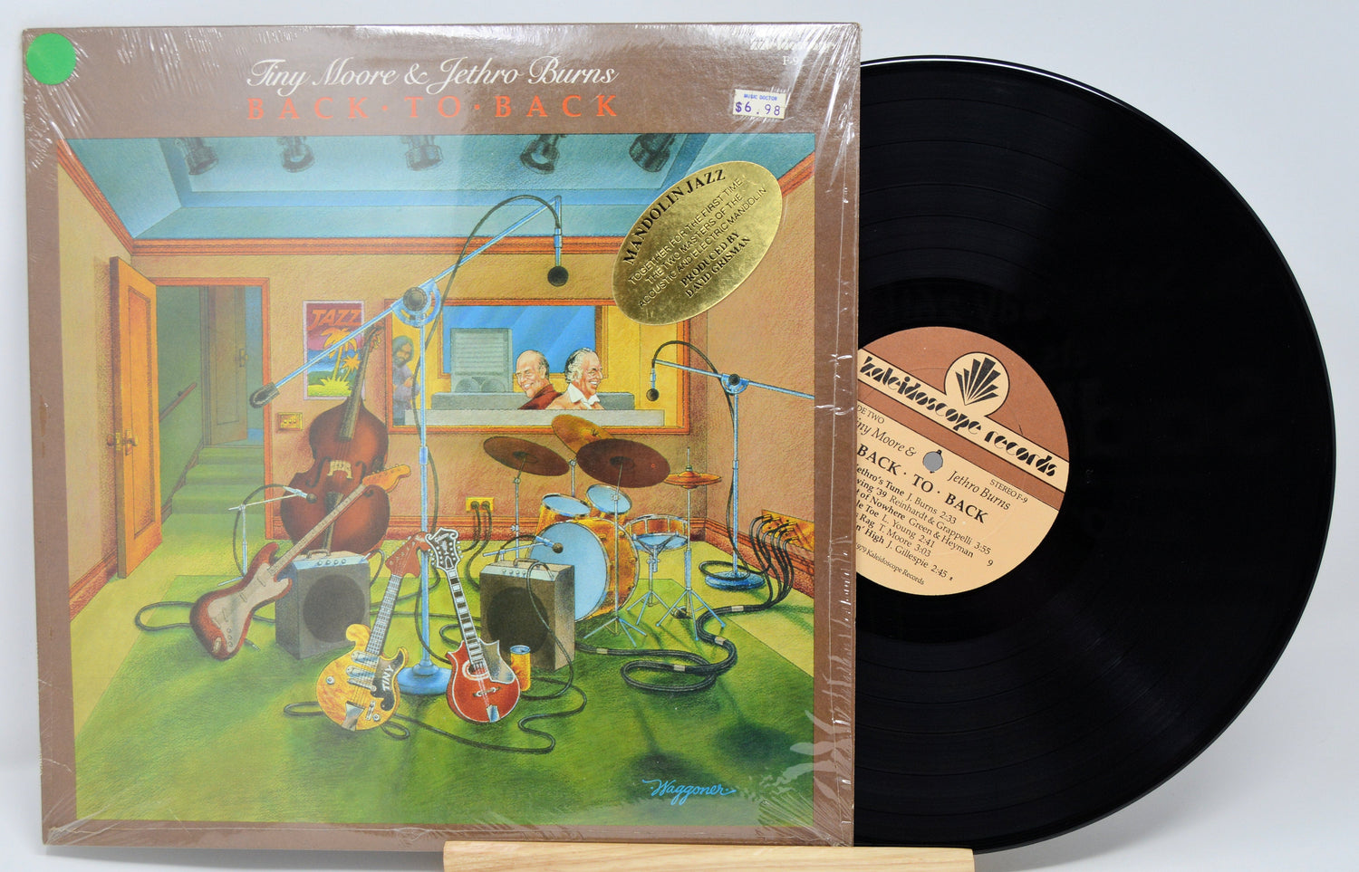 Front cover illustration of Tiny Moore & Jethro Burns' Back to Back vinyl LP with jazz instruments in a studio