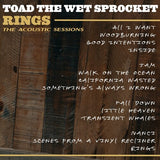 Album cover with acoustic session tracklist on a wooden background