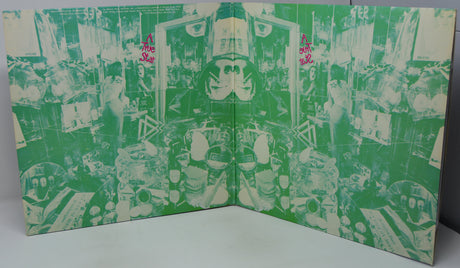 Green and white patterned book or album cover with abstract designs