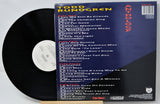 Vinyl record with a blue cover displaying track listings and album details.