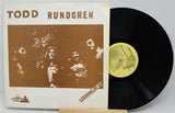 Vinyl record with cover featuring 'Todd Rundgren' and a brown image of people.