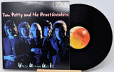 Vinyl record with 'Tom Petty and the Heartbreakers' album cover showing band members.