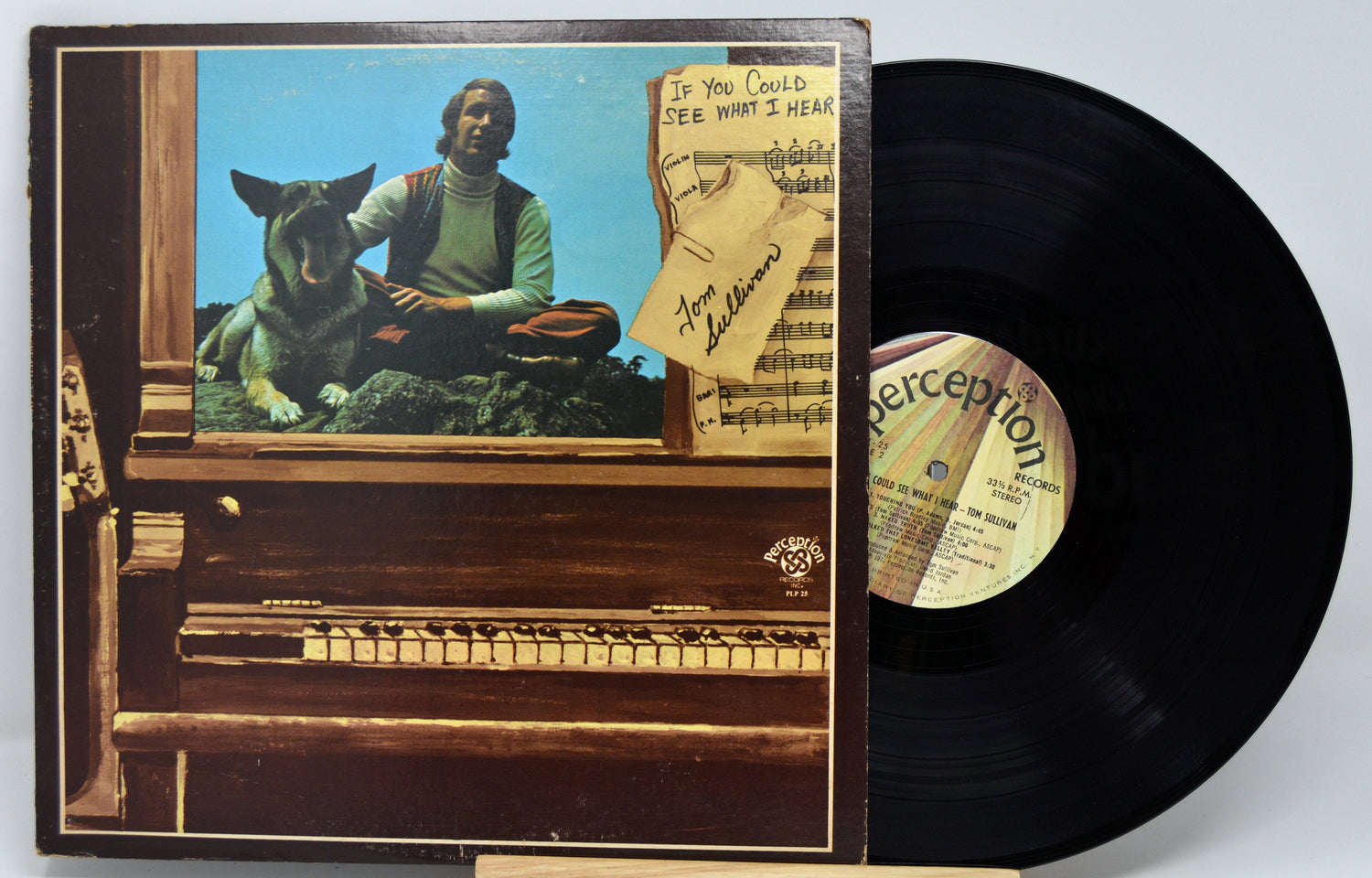 Front cover of Tom Sullivan's 'If You Could See What I Hear' vinyl LP with piano, sheet music, and dog
