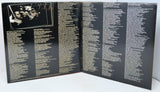 Open book or album with text on a black background