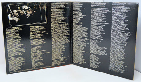 Open book or album with text on a black background