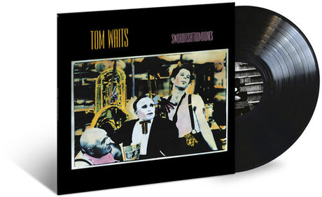 Album cover art for Tom Waits - Swordfishtrombones featuring a photograph of Tom Waits and members of his band with musical equipment.