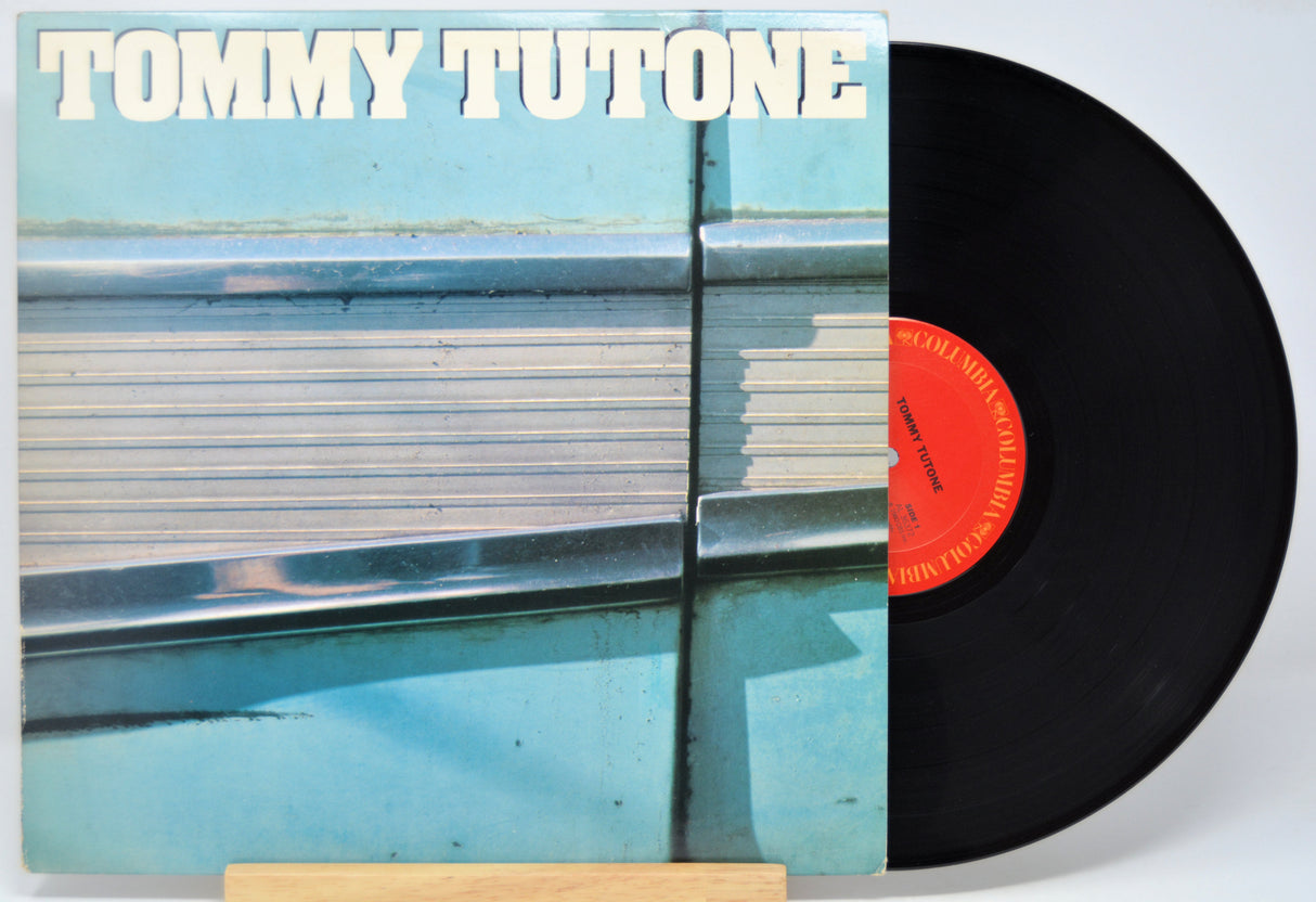 Vinyl record with Tommy Tutone album cover featuring a blue and white design.