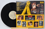 Back cover of Tough Enough original motion picture soundtrack vinyl LP with tracklist and movie scenes
