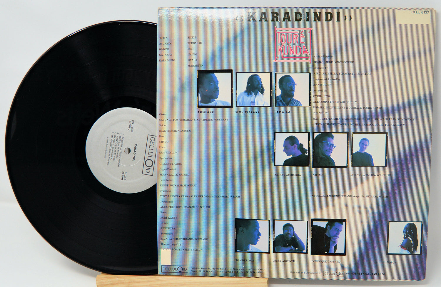 Back cover and vinyl record of Toure Kunda's Karadindi LP featuring band member photos and track listing