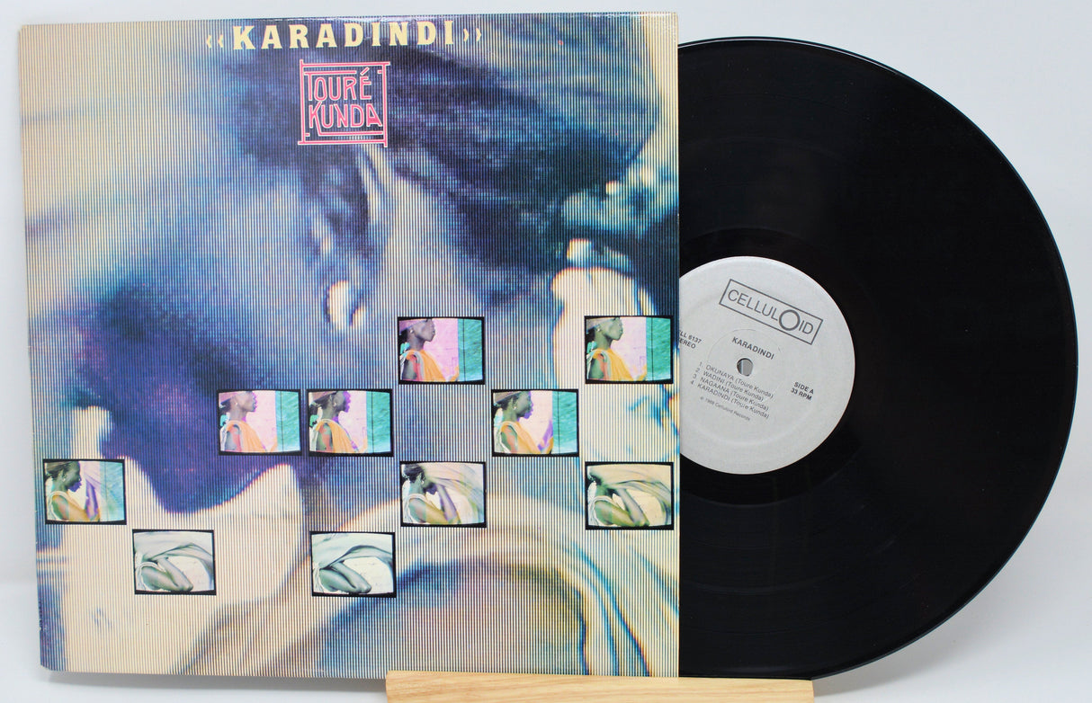 Front cover and vinyl record of Toure Kunda's Karadindi LP with artistic cover design and album logo