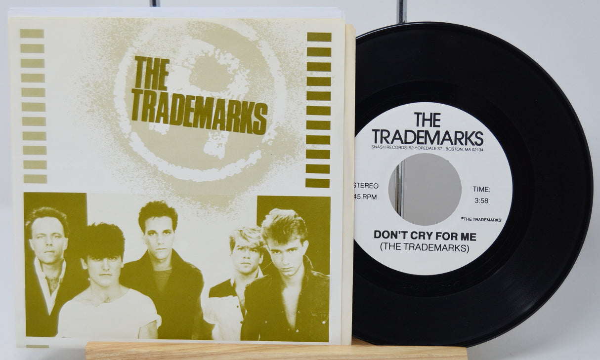 Vinyl record and cover with 'The Trademarks' on a white background