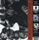 Vintage black-and-white photo of musicians performing traditional drumming and ceremonial dance