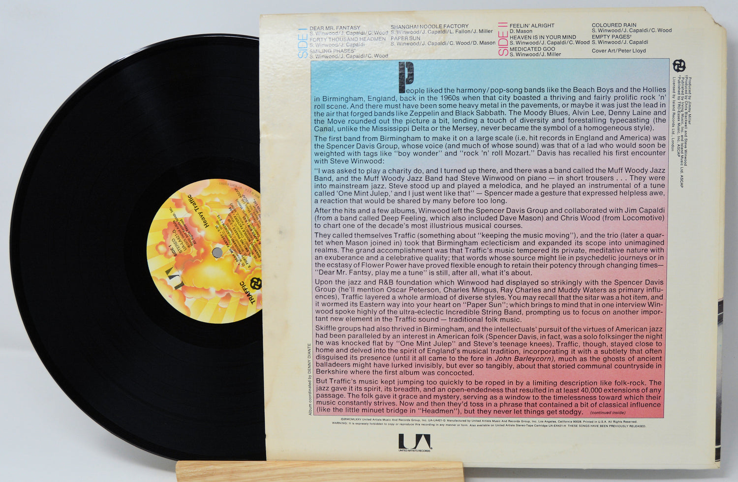 Vinyl record with a colorful label and text on a white background