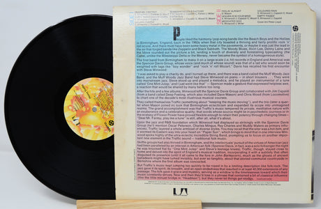 Vinyl record with a colorful label and text on a white background