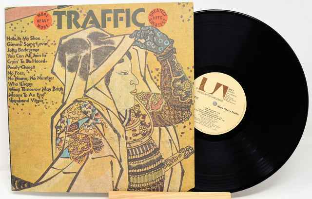 Vinyl record with cover featuring an artistic design of a woman, titled 'Traffic'.