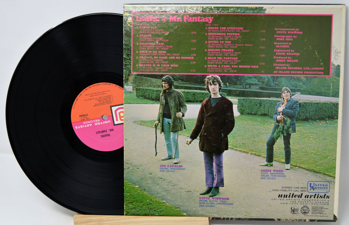 Vinyl record with a colorful cover featuring images of a band member and text.