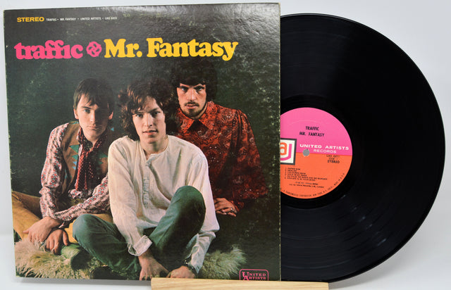 Vinyl record with cover featuring three individuals and 'traffic & Mr. Fantasy' text.