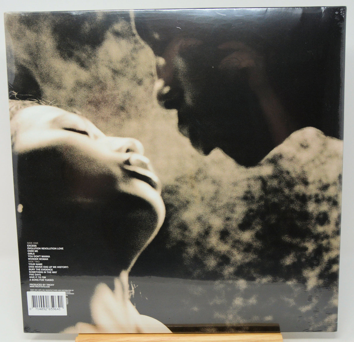 Back cover of Tricky's Blowback 20th Anniversary vinyl with artistic close-up portrait