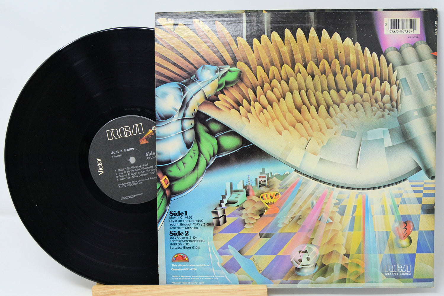 Vinyl record with colorful album cover featuring a futuristic design.
