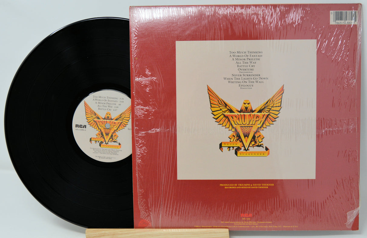 Vinyl record with red cover featuring an eagle design on a white background