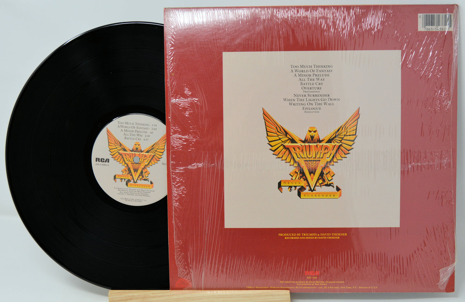 Vinyl record with red cover featuring an eagle design on a white background