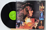 Vinyl record with a colorful album cover featuring a musician playing guitar.