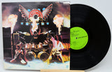Vinyl record with a colorful cover featuring musicians and flames on a white background