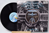 Vinyl record with its cover featuring intricate design and text.