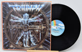 Vinyl record with cover featuring a mechanical design and 'Triumph' branding.