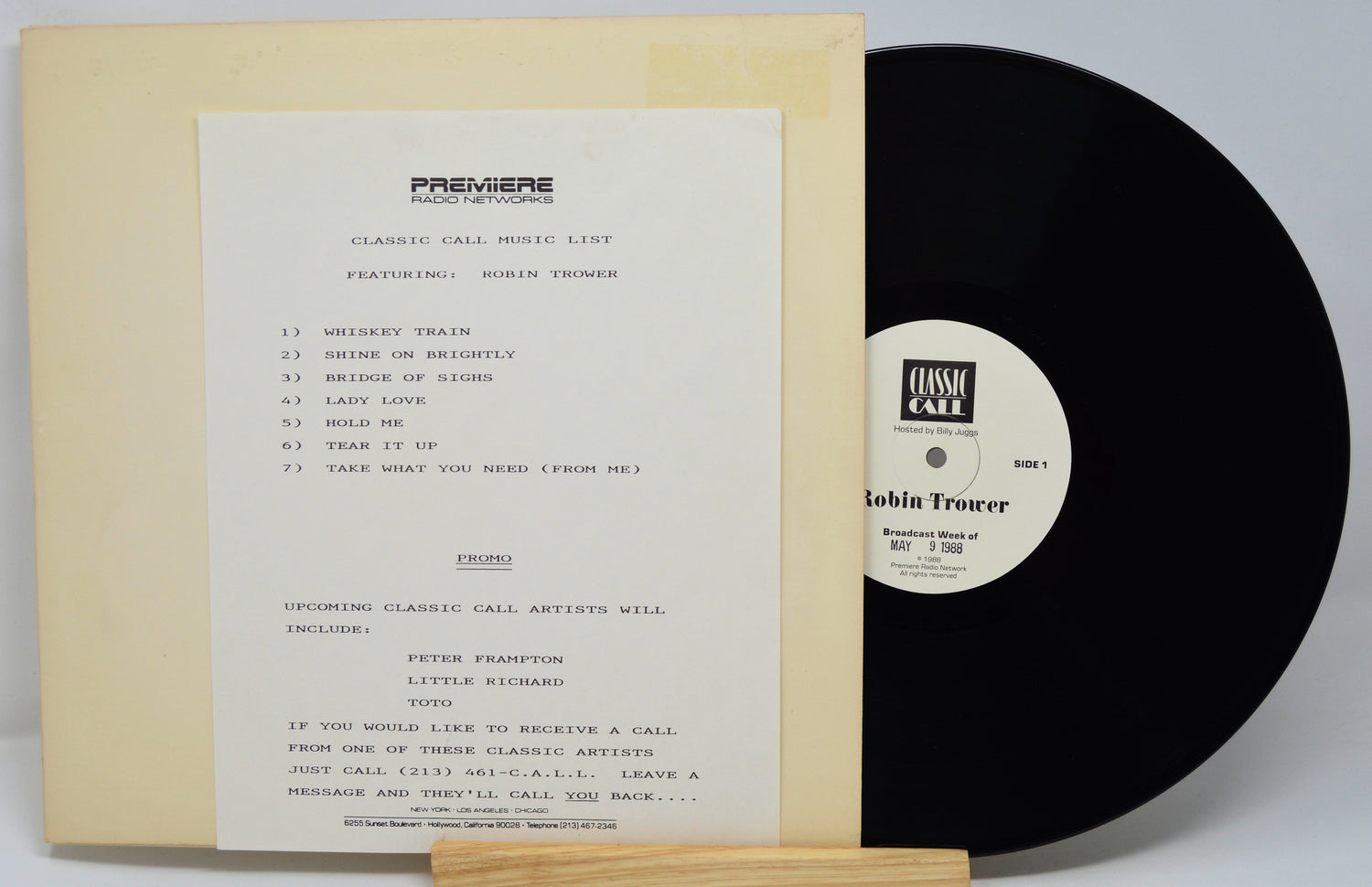 Vinyl record with a sleeve featuring text and a label on a white background