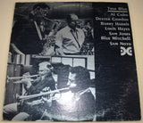 Front cover of True Blue album featuring musicians playing jazz instruments