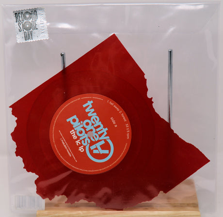 Twenty One Pilots The LC LP Red vinyl record with a label in a clear sleeve, on a white background