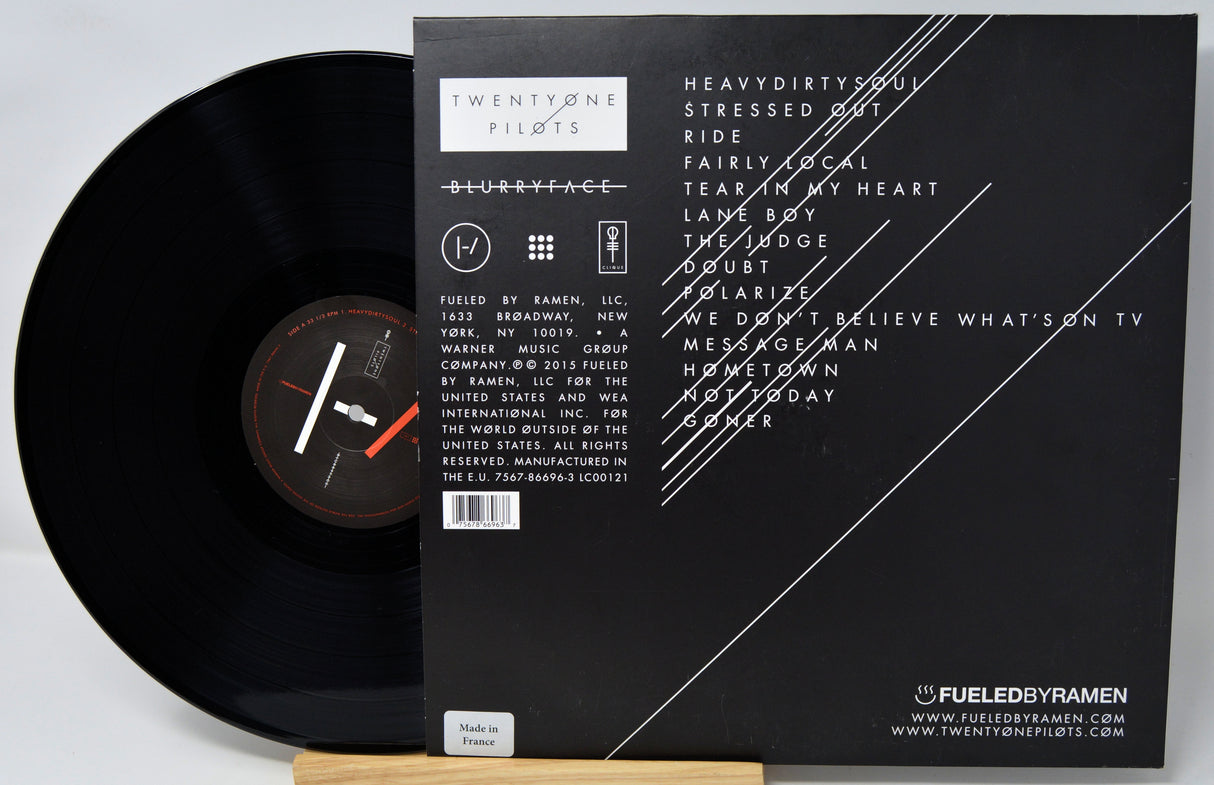 Vinyl record with its cover displaying text and branding.