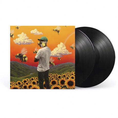 Tyler The Creator - Flower Boy Album cover art for Tyler The Creator - Flower Boy featuring a person with their back turned to the camera wearing a hat, standing in a field of sunflowers with bees and clouds in the sky.