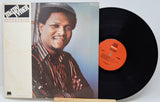 A vinyl record album for 'Micko Yunker - Operatio' shown with its illustrated cover sleeve and the black record partially pulled out, featuring a bright orange center label.