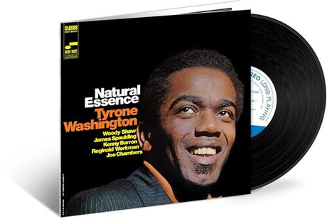 Vinyl record with cover featuring a smiling man and album title 'Natural Essence' by Tyrone Washington.